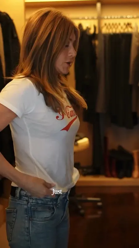 Jennifer Aniston's Chewed Hem Jeans, Graphic T-Shirt And Hair Products